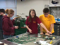 Students working on the pneumatic subsystem