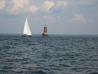 NA 13 Resolute sailing off of Bloody Point Lighthouse in the Bay