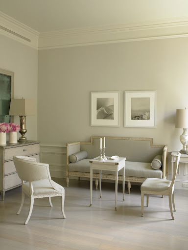 A pair of framed photographs punctuate this living room.