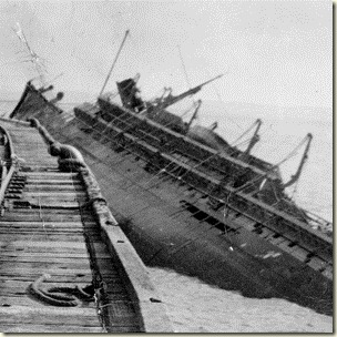 THE KOOLAMA SINKING AT A NORTHERN PORT AFTER BEING BOMBED BY THE JAPANESE ON 20 FEBRUARY 1942. DD3979