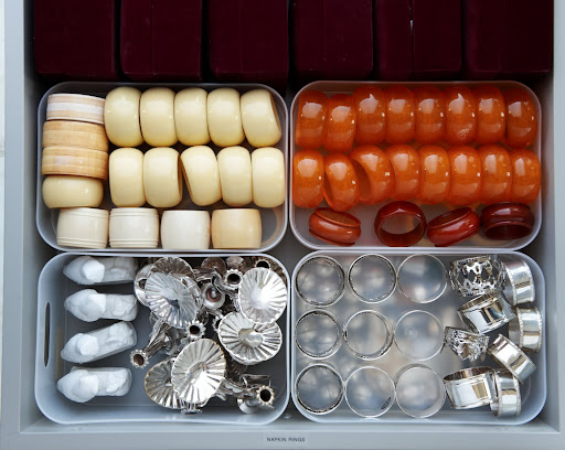 Organize napkin rings into plastic containers, so you'll never have to worry about losing or misplacing any rings. Organize napkin rings into plastic containers, so you'll never have to worry about losing or misplacing any rings.