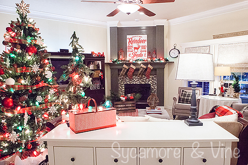 A living room decorated around the plaid Country Christmas theme. A truly stunning Christmas Home Tour as part of the Christmas in the Country Blog Tour. This Plaid Inspired Country Christmas will knock your socks off. Features tours of the Living room, Dining Room and a Cocoa hot chocolate bar in the Breakfast room. There is so much inspiration for Christmas decorations in this one post. Be prepared to feel like you are cuddled up by the fire in a warm Northwoods comfy cottage! #country #Christmas #Plaid #Holiday decorating #Holiday ideas #Holidays #Christmas decor #Holiday decor A living room decorated around the plaid Country Christmas theme. A truly stunning Christmas Home Tour as part of the Christmas in the Country Blog Tour. This Plaid Inspired Country Christmas will knock your socks off. Features tours of the Living room, Dining Room and a Cocoa hot chocolate bar in the Breakfast room. There is so much inspiration for Christmas decorations in this one post. Be prepared to feel like you are cuddled up by the fire in a warm Northwoods comfy cottage! #country #Christmas #Plaid #Holiday decorating #Holiday ideas #Holidays #Christmas decor #Holiday decor