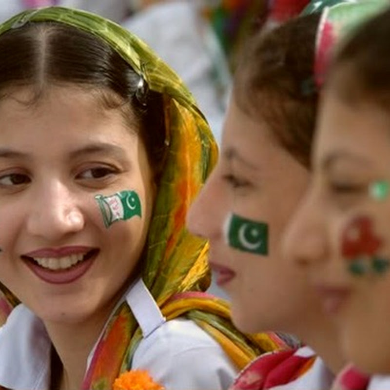 Young Girls in school looking happy having Pakistan Flag