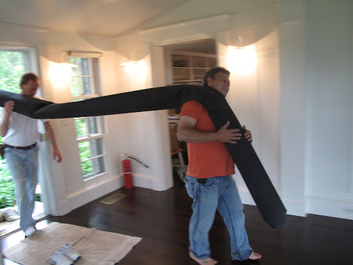 Well, look who it is!  It's Fernando, carrying a roll of something.