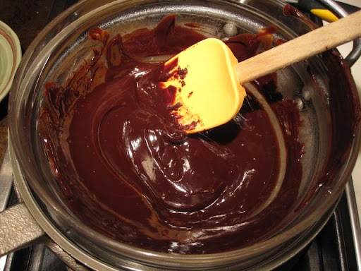 Melting the chocolate and water. Melting the chocolate and water.