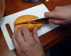 Steve carefully slices the mango for his fruit salad.