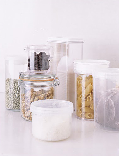 See-through containers are a storage solution that add a decorative element to your kitchen. They protect dried goods from the humidity and pests as well.