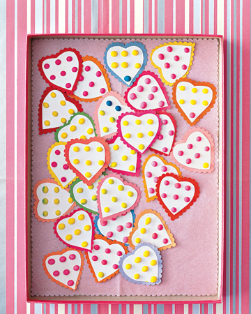 Candy buttons cut in the shape of a heart will fit perfectly in an envelope.