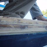 Close-up of the epoxy glue and filler.  The filler is whitish, the glue is darker.  Both are special for teak (or any oily wood). We hope they will hold over time, but we also screwed the caprail to the rubrail to make sure it does hold.