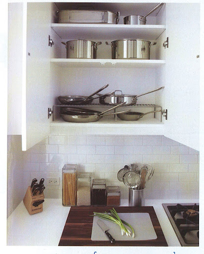 You can see my pots and pans on the rack in the cabinet. It's much easier for me to access what I need.