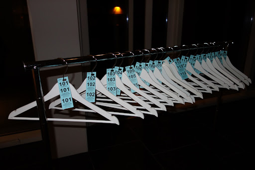 Because of the weather and number of guests, I set up a coat check in the lobby of my building. I had five rolling racks from Container Store, tons of white coat hangers, and coat check tickets kept everything neat and orderly. A very handsome attendant helped my guests.
