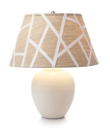 Use crisscrossed lengths of twill tape to turn a plain linen shade into a striking graphic one. (marthastewart.com) Use crisscrossed lengths of twill tape to turn a plain linen shade into a striking graphic one. (marthastewart.com)
