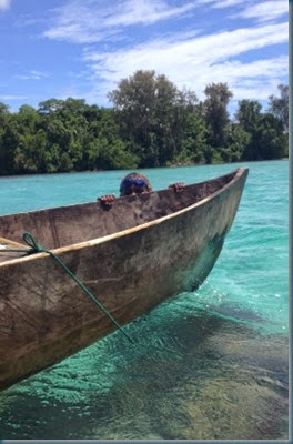 Jayli peeking over canoe