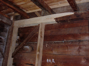 Like the girts one floor above, this girt has a free tenon and three inch beech planks added to support the girt.  The brace above the girt had a keyed tenon repair.