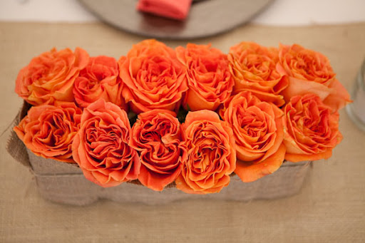 Orange roses are gorgeous to cluster or tuck in other arrangements. (www.stylemepretty.com) Orange roses are gorgeous to cluster or tuck in other arrangements. (www.stylemepretty.com)