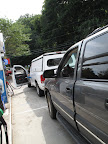 So that's how you pump gas.  I'll just follow that white truck's lead and put that hose into the gas tank.