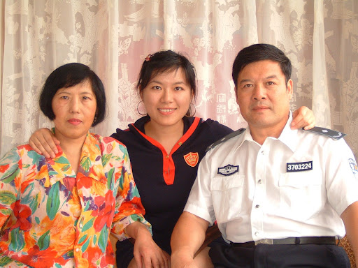 Jin Pang with her mother and father, both of whom were arrested last July. Her father has since been released, but Pang says her mother is still being held in a detention center. Photo courtesy Jin Pang.