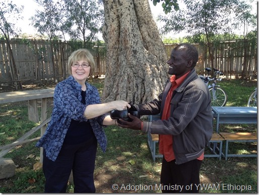 Giving shoes to evangelist-a