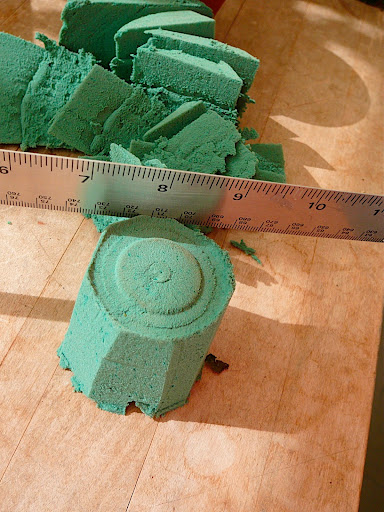 I like using a metal ruler to cut. It's a straight, rigid edge that makes a clean, smooth cut. I tapered it away as I cut to make an inverted ice cream cone shape.