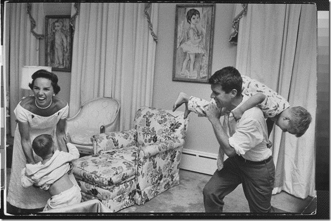 Bobby Kennedy, chief counsel of Sen. Comm. on Labor & Management, carrying his pajama clad young son Joe over his shoulder like a sack of potatoes as his wife Ethel roars w. laughter while trying to fend off another son during bedtime roughhouse, at home.  (Photo by Paul Schutzer//Time Life Pictures/Getty Images)
