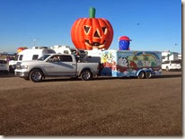 Pumpkin head behind Arky chase vehicle