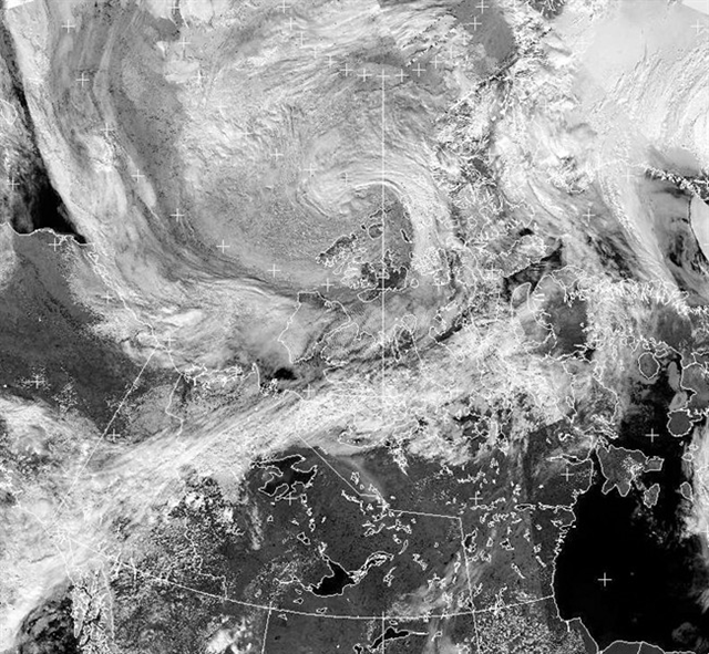 A cyclone (top centre) forms over the Canadian Arctic in an Environment Canada NOAA satellite imagery taken at 15:42 Eastern time on Thursday, 25 July 2013. Photo: THE CANADIAN PRESS / HO