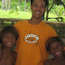 Glenn Bill gamely poses with Badjao kids at Babu Santa Beach Resort, Talikud Island