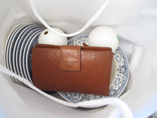 Inside one of our editor's bags; some lovely blue plates and a wallet!