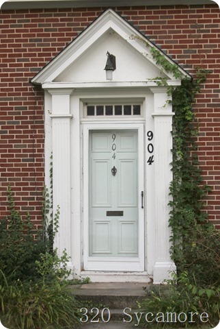 white door   brick   vine