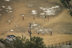 Playing football at the foot of Swayambhunath stupa hill