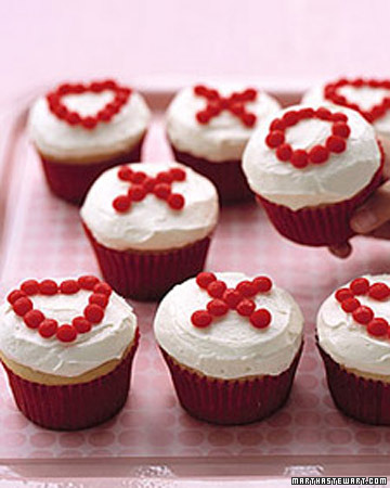 Plain cupcakes get a simple yet fun makeover with red hot candies in the shapes of X's and O's. http://www.marthastewart.com/270692/xs-and-os-cupcakes