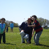 Eidan, Kai, and Mike flying a kite at Brenton Point in Newport