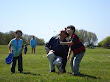 Eidan, Kai, and Mike flying a kite at Brenton Point in Newport