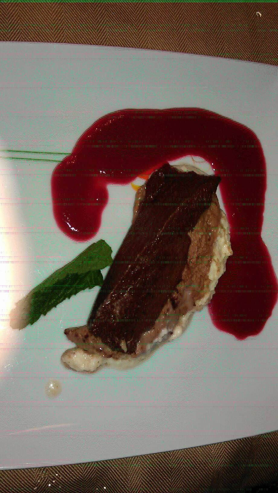Matts triple chocolate terrene with raspberry sauce