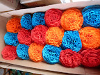 La La Laurie crafted a bunch of different fascinators for the ladies to sport around midnight. Here are the large crepe paper flowers, in a trio of colors.