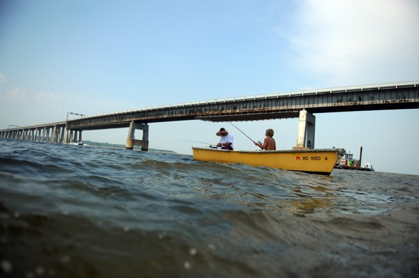 Mike Kirschner and his son Zachary, 10, of Bel Air, Md., fish below the Chesapeake Bay Bridge in Annapolis, Maryland. Ricky Carioti / THE WASHINGTON POST