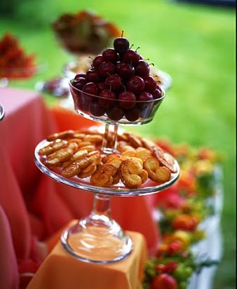 Using a flat surfaced stand on the bottom and a bowl-shaped one on the top allows you to pair different items together. Another great combination would be to place a vegetable dip on the top with celery, carrots and other veggies below.