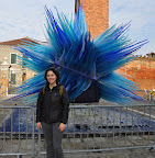 In front of the glass statue