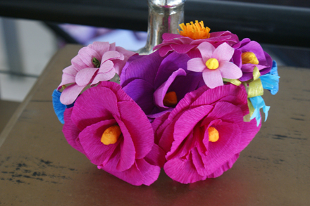 We made literally hundreds of crepe paper flowers into aisle markers. Thanks to Castle in the Air for keeping us well stocked in awesome German duplex crepe paper!
