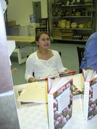 John’s daughter, Nola, peruses the cookbook.