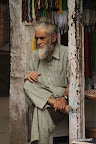 Old Nepalese man at his shop
