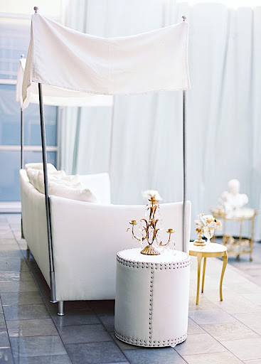 The group wanted a luxurious vibe but, because of the tight color palette, they were able to keep it clean and not overly fussy. Sophisticated white furniture and linens popped thanks to gold accents and fun designs.