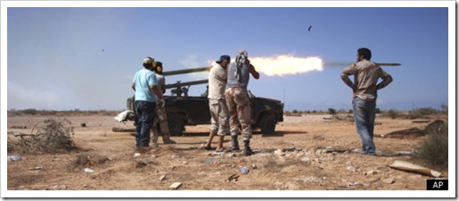 Anti-Gaddafi Fighters Loot, Burn Homes In Sirte