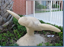 6397 Texas, South Padre Island - flying sea turtle sand sculpture in front of South Padre Island City Hall