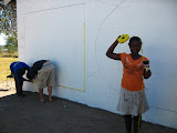 With the Art Club, we also painted a mural of a world map and South African map at Mahlahluvana during the World Cup school break. Nelisiwe was playing with the measuring tape, not exactly sure why, but it looks funny! South Africa - 390.jpg