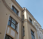 The box shape of the downspouts climes the buildings.