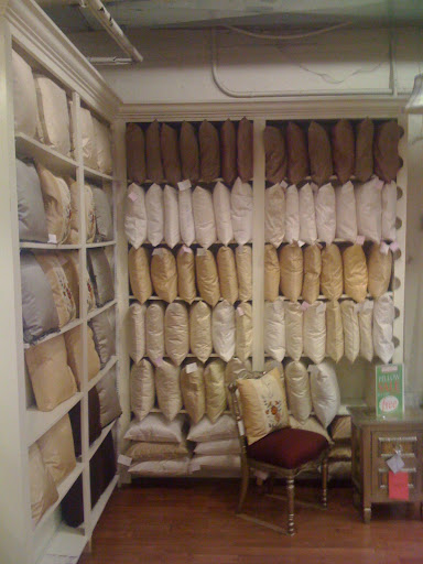 Here's a wall of pillows in the Silk Trading Company's signature silks. Let's take a look at the choices!