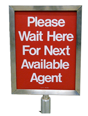 c0 This sign says "Please wait here for next available agent."