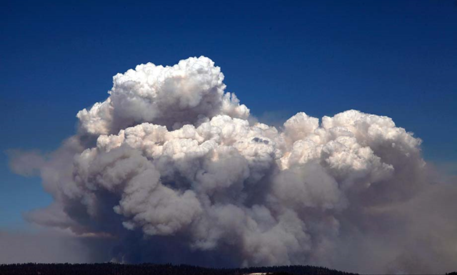 A huge smoke cloud rises into the air in Tuolumne County on Tuesday, 20 August 2013, as the Rim fire continues to rage. This image was shot coming down from the Glacier View. Photo: Barbara Davidson / Los Angeles Times