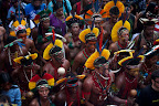 Indigenous marchers on Rio’s Flamengo Beach on June 19, 2012. Their bodies formed the lines of an enormous image promoting the importance of free-running rivers, truly clean energy sources like solar power and including indigenous knowledge as part of the solution to climate issues. The activity was led by Brazil’s many indigenous peoples organized under the umbrella of the Articulation of Brazilian Indigenous Peoples. ©Caroline Bennett